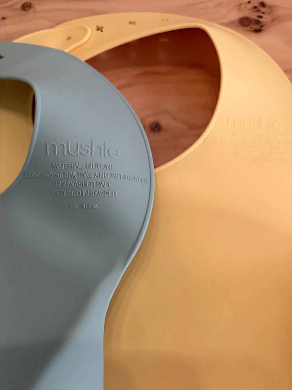 Mushie Adjustable Silicone Bibs for Toddlers in Sage Green and Pale Yellow
